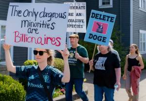 Marchers walk through downtown Duvall during the Hands Off! protest April 5, 2025. Photo courtesy of Travis Wetherbee/Last Lite Photography