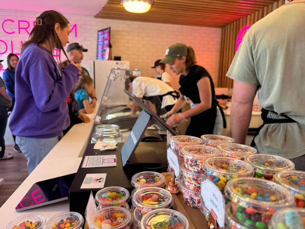 Workers serve ice cream during the grand opening of Mooo! April 5, 2025. (Grace Gorenflo/Valley Record)