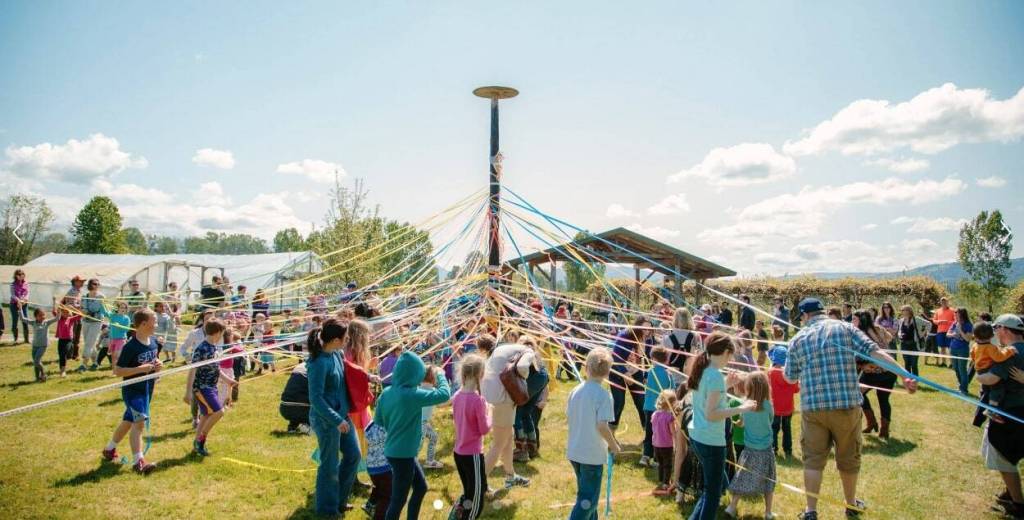 Visitors partake in a maypole dance to celebrate May Day at Jubilee Farm. Photo courtesy of Jubilee Farm