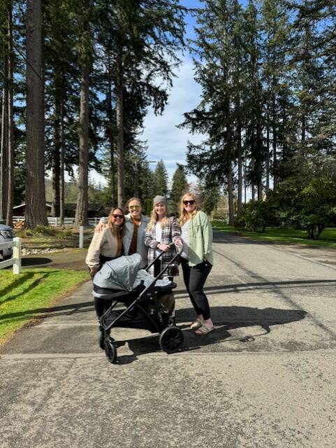 A group of moms stand for a photo during a Fall City walk in April 2025. Photo courtesy of Gretchen Rohrbaugh
