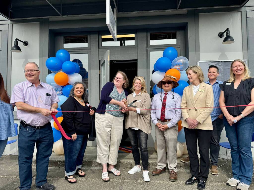 Reclaim staff and board members prepare to the cut the ribbon at the nonprofits ribbon-cutting ceremony May 8, 2025. (Grace Gorenflo/Valley Record)