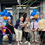Staff and board members of Reclaim celebrate their ribbon cutting May 8, 2025. (Grace Gorenflo/Valley Record)