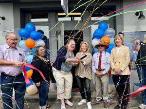 Staff and board members of Reclaim celebrate their ribbon cutting May 8, 2025. (Grace Gorenflo/Valley Record)