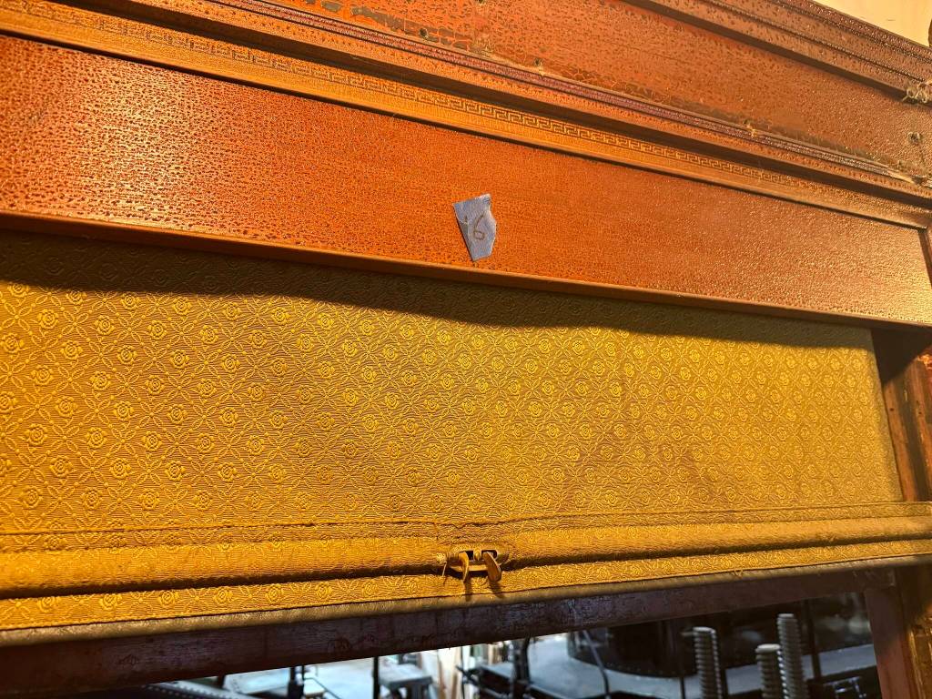 An original window shade in parlor car 1049, April 29, 2025. (Grace Gorenflo/Valley Record)