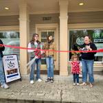 Carnation Chamber of Commerce Vice President Erin Barzen speaks at the ribbon cutting of The Book Nest April 19, 2025. (Grace Gorenflo/Valley Record)