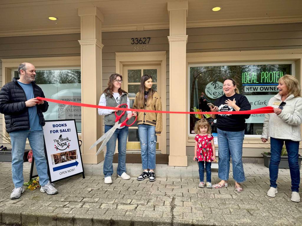 Carnation Chamber of Commerce Vice President Erin Barzen speaks at the ribbon cutting of The Book Nest April 19, 2025. (Grace Gorenflo/Valley Record)