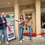 The Book Nest owner Andrea Amstutz cuts the ribbon at her ribbon-cutting ceremony April 19, 2025. Amstutz was joined by her husband and daughter. Grace Gorenflo/Valley Record