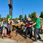 Carnation Cafe owner Don Langhans and Snoqualmie Valley Equestrian Association member Joe Mellin cut the ribbon at the ribbon cutting of the Carnation Cafe horse hitch post, June 5, 2025. Photos by Grace Gorenflo/Valley Record