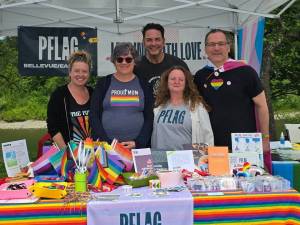 SnoValley Pride founder Gregory Jamiel (center) stands with members of PFLAG (Parents, Families and Friends of Lesbians and Gays) at Fall City Day 2025. Photo courtesy of SnoValley Pride