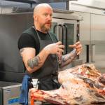 Carnation Farms butcher Thomas Cross teaches a workshop on breaking down meat. Photo courtesy of Carnation Farms
