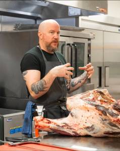 Carnation Farms butcher Thomas Cross teaches a workshop on breaking down meat. Photo courtesy of Carnation Farms