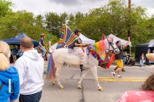 Robyn Atkins rides her horse Duke, dressed as a unicorn, in the 2025 Fall City Day parade. Photo courtesy of SnoValley Pride
