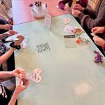 Guests do an art project at the new location of Works from the heART in downtown North Bend, July 10, 2025.
