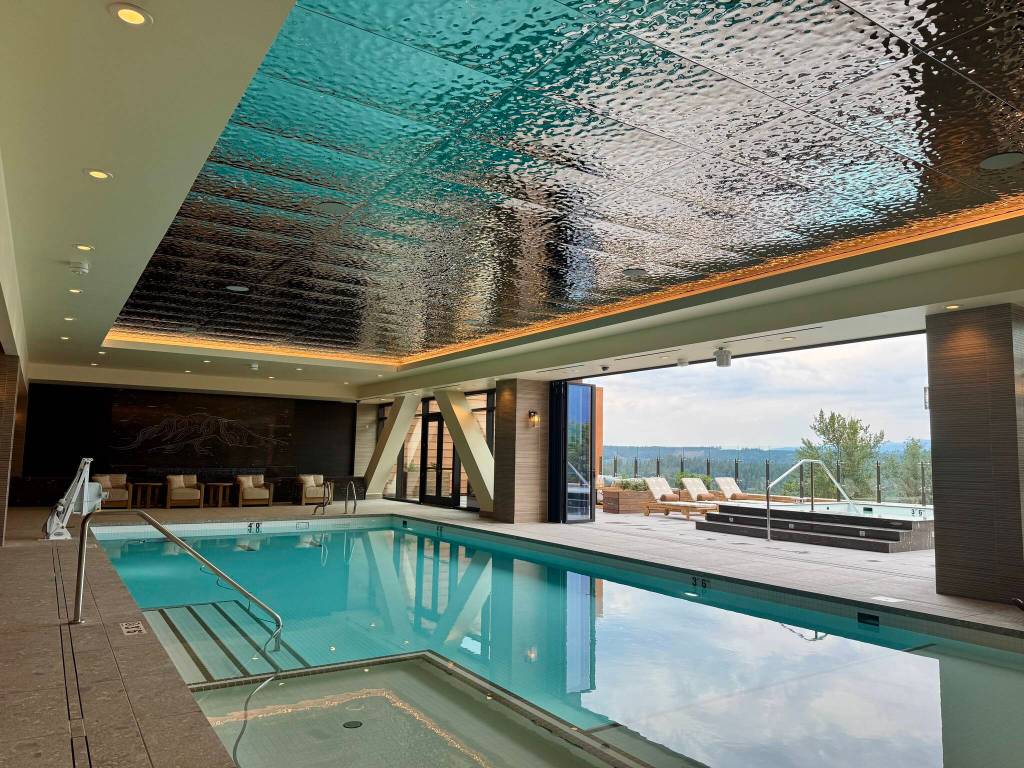 The indoor pool, with doors open to the deck, at the Snoqualmie Casinos new hotel, July 31, 2025. (Grace Gorenflo/Valley Record)