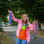 North Bend Downtown Foundation Executive Director Jessica Self prepares to hand out medals at the Festival at Mount Si 5k run, Aug. 9, 2025. 
Photo courtesy of KKPJ Photography