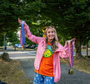 North Bend Downtown Foundation Executive Director Jessica Self prepares to hand out medals at the Festival at Mount Si 5k run, Aug. 9, 2025. 
Photo courtesy of KKPJ Photography