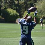 Running Back Kenneth Walker makes an over the shoulder catch in a drill. Ben Ray / Sound Publishing