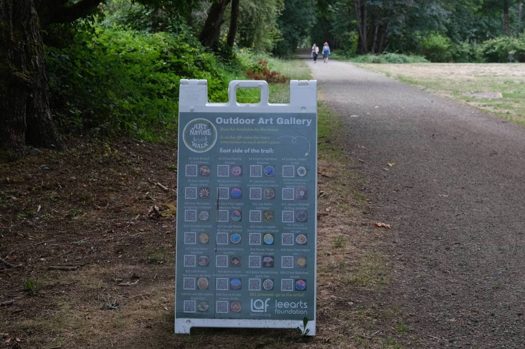 Grace Gorenflo/Valley Record
A sign lists all of the art available for view on the Art in Nature trail walk on the Snoqualmie Valley Trail in Carnation, Aug. 18, 2025.