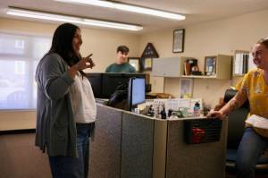 Duvalls community events coordinator Rita Moreno (left) chats with Deputy City Clerk Kelsey MacDonald in the office, Aug. 13, 2025. (Grace Gorenflo/Valley Record)