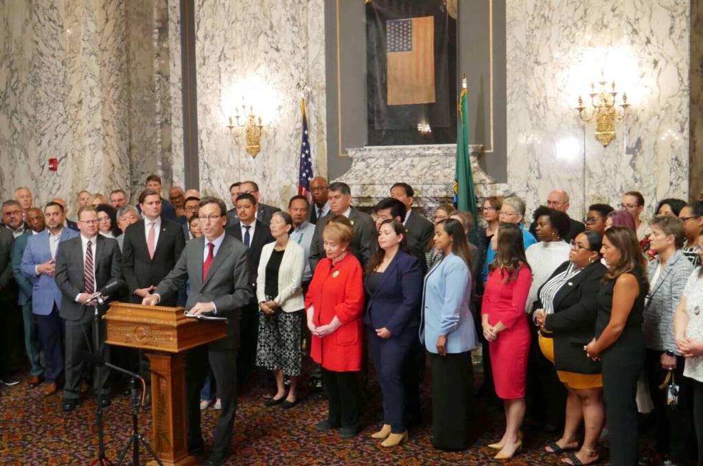 Gov. Bob Ferguson makes remarks during a press conference at the state Capitol in Olympia, on Aug. 19, responding to a letter he received the previous week from U.S. Attorney General Pam Bondi, threatening to withhold federal funding if the state does not change its approach cooperating on federal immigration enforcement. (Photo by Bill Lucia/Washington State Standard)