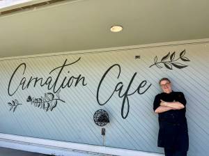 Carnation Cafe owner Don Langhans stands for a photo in front of the restaurant, July 24, 2025. (Grace Gorenflo/Valley Record)