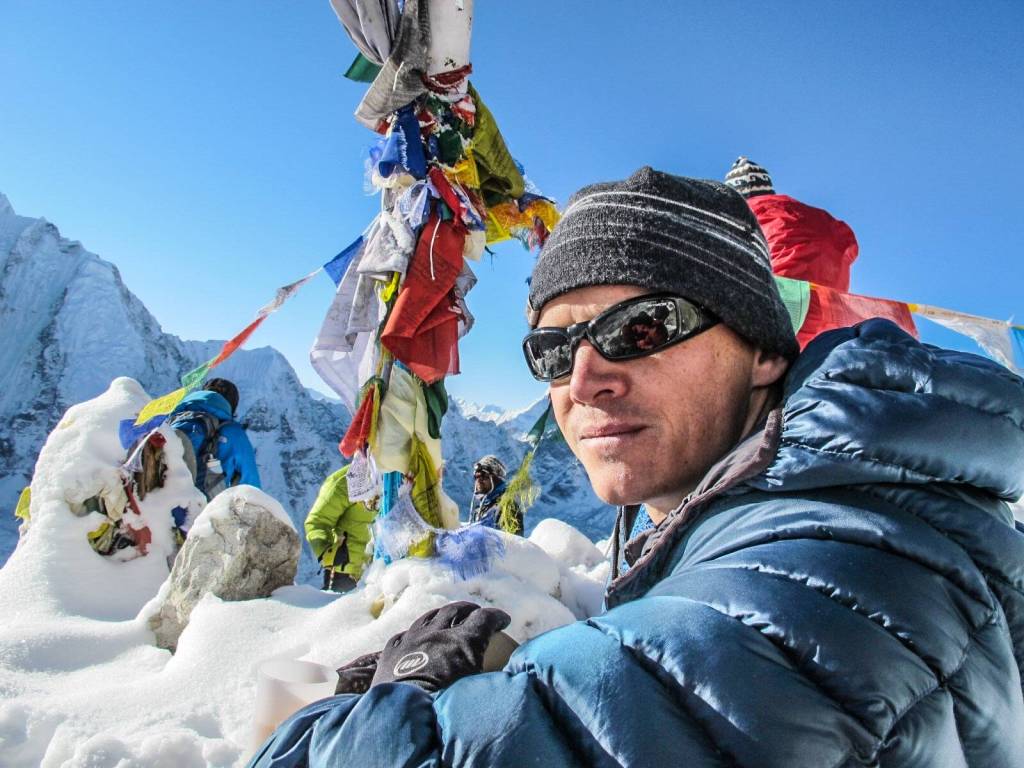 Brian Dickinson, author of Bloodline of Redemption, atop Mount Everest in 2011. Photo courtesy of Brian Dickinson