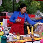 A vendor serves corn to a customer at the North Bend Farmers Market, Sept. 11, 2025. Grace Gorenflo/Valley Record