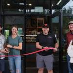 Arete owners Meghan and David Schumacher prepare to cut the ribbon on their second coffee location at The Line Bike Experience in North Bend, Sept. 12, 2025.