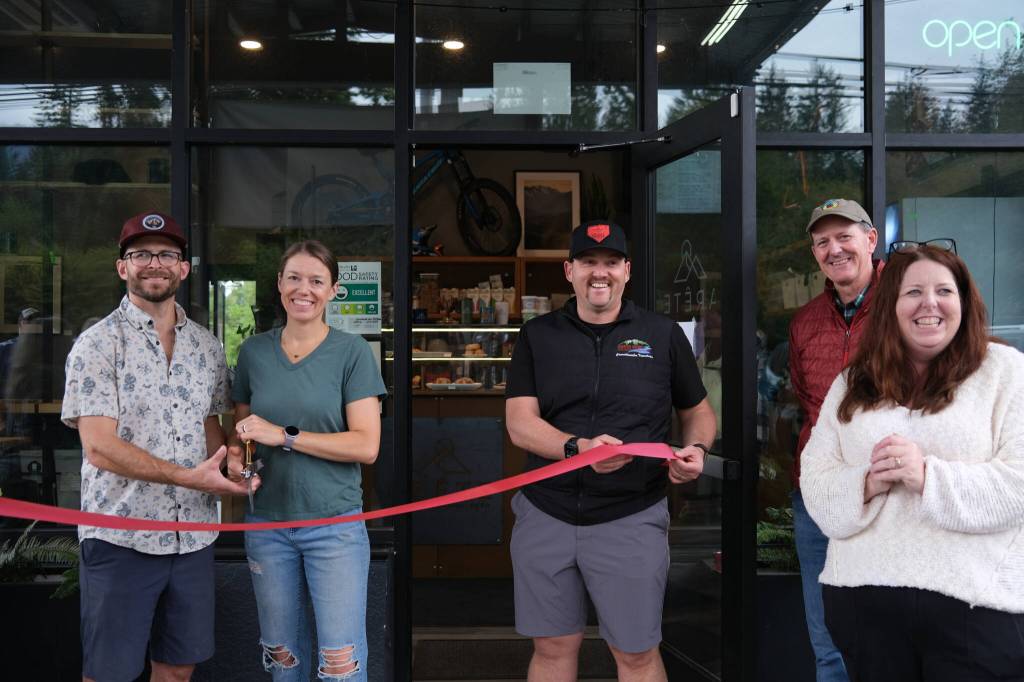 Arete owners Meghan and David Schumacher prepare to cut the ribbon on their second coffee location at The Line Bike Experience in North Bend, Sept. 12, 2025.