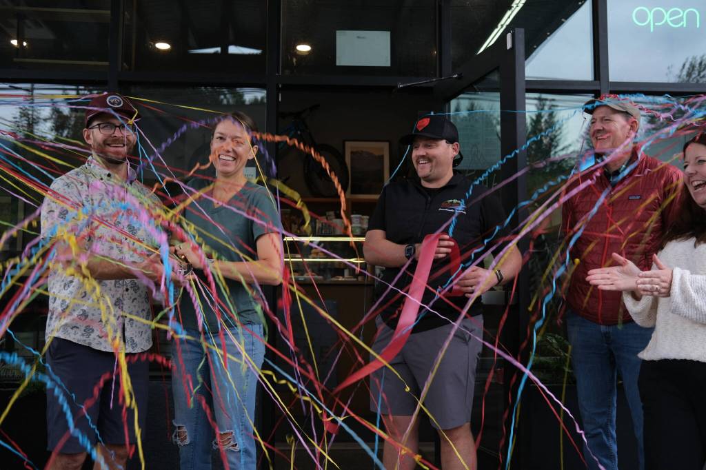 Arete owners Meghan and David Schumacher cut the ribbon on their second coffee location at The Line Bike Experience in North Bend, Sept. 12, 2025.