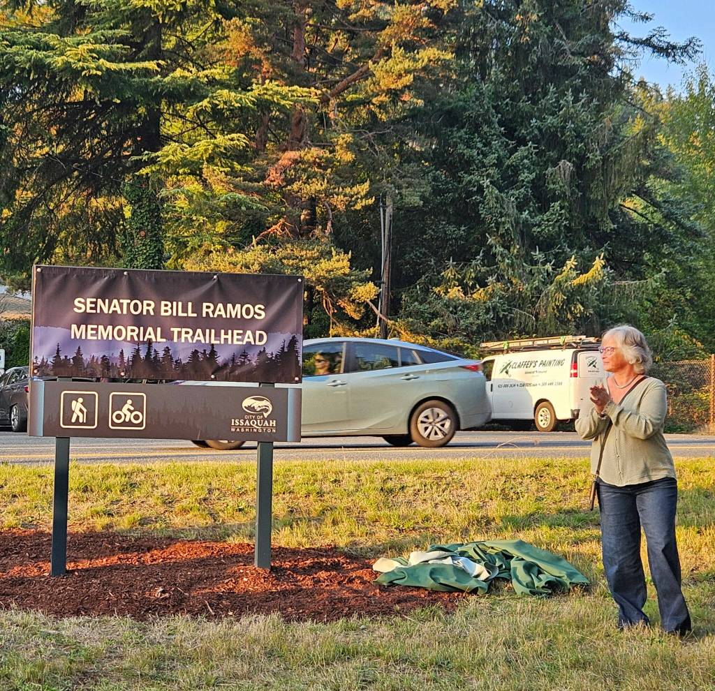 King County Councilmember Sarah Perry unveils the new Issaquah trailhead marker named after her late husband Sen. Bill Ramos, Oct. 6, 2025. Photo courtesy of Sarah Perry