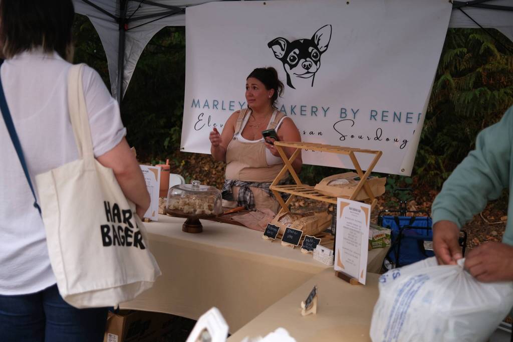 Renee Petitti, owner of Marleys Bakery, sells her fresh sourdough at the Duvall Farmers Market, Sept. 4, 2025. (Grace Gorenflo/Valley Record)