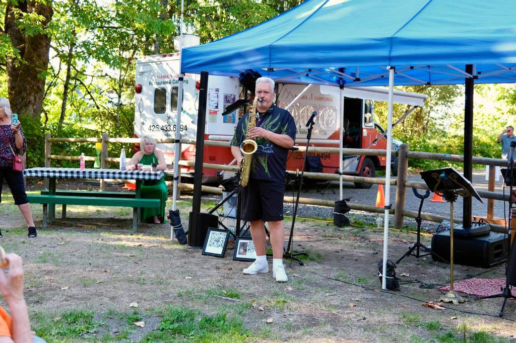 A saxophone player plays live music at the Duvall Farmers Market, Aug. 21, 2025. (Grace Gorenflo/Valley Record)