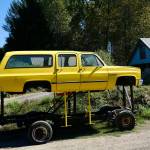 The Floodmobile, a Chevrolet Suburban raised to drive through flood waters, sits on Cook Farm, Sept. 16, 2025. This iteration of the Floodmobile is owned by Dan Cook, with an earlier version being owned by his father. Cook says he hasnt had to use the Floodmobile in many years, but he still brings it out for Duvall parades and events. (Grace Gorenflo/Valley Record)