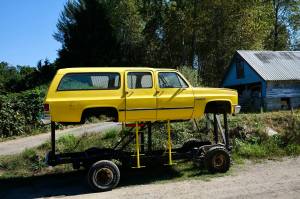 The Floodmobile, a Chevrolet Suburban raised to drive through flood waters, sits on Cook Farm, Sept. 16, 2025. This iteration of the Floodmobile is owned by Dan Cook, with an earlier version being owned by his father. Cook says he hasnt had to use the Floodmobile in many years, but he still brings it out for Duvall parades and events. (Grace Gorenflo/Valley Record)