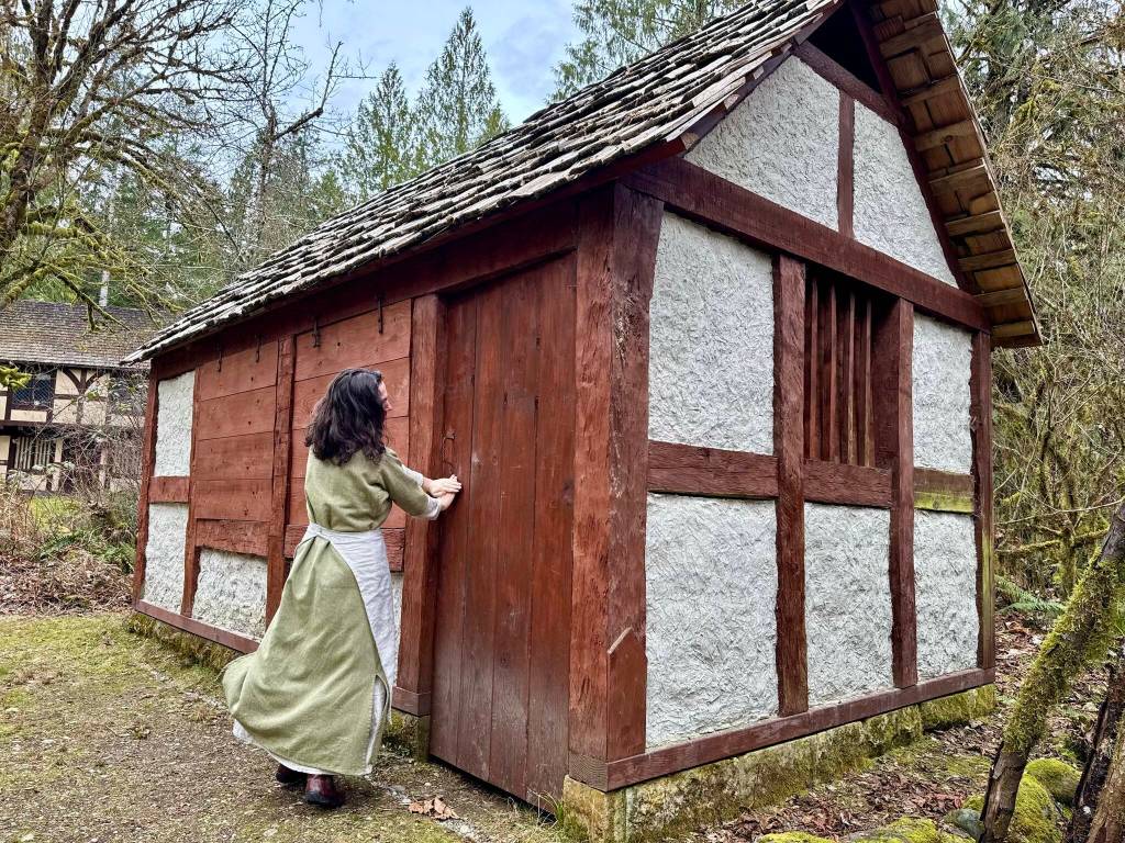 Camlann Medieval Village Executive Director Lauren Poyer shows a cottage at Camlann, March 9, 2025. Photo by Grace Gorenflo/Valley Record