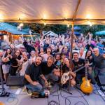 Photo courtesy of Travis 
Wetherbee/Last Lite Photography
Above, people gather to watch a performance by Eden at the inaugural Carnation Concert Crawl, Aug. 17, 2025.