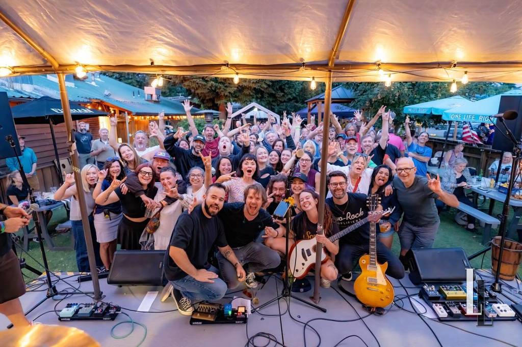 Photo courtesy of Travis 
Wetherbee/Last Lite Photography
Above, people gather to watch a performance by Eden at the inaugural Carnation Concert Crawl, Aug. 17, 2025.