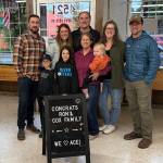 Ron Cox with his wife, KC, and his two sons, Michael and Stephen, and their families (minus one grandson). Photo courtesy of Sara Cox