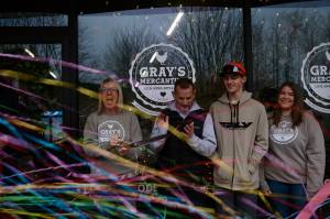 The Stumpf family celebrates after Grays Mercantile founder Summer Stumpf cuts the ribbon, Nov. 15, 2025. (Grace Gorenflo/Valley Record)