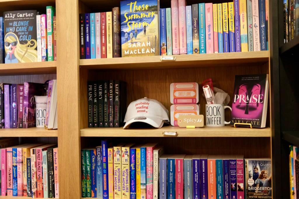 The Books and Bottles romance section, Sept. 9, 2025. The shop curates collections across genres. (Grace Gorenflo/Valley Record)