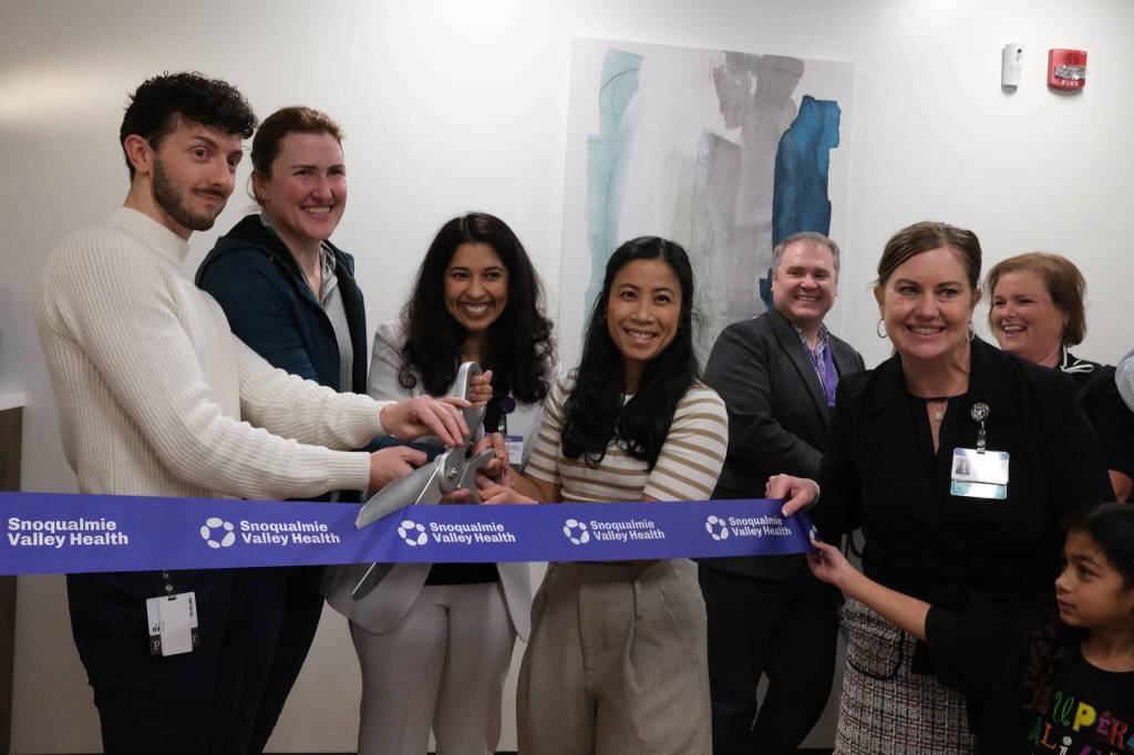 Snoqualmie Valley Health providers take part in a second ribbon-cutting with CEO Renee Jensen (right), Nov. 19, 2025. (Grace Gorenflo/Valley Record)