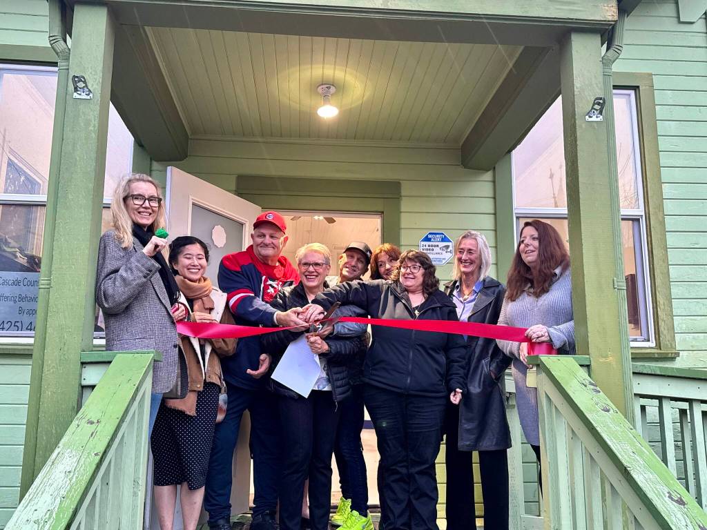 Chaplain Patti Yetneberk and her team prepare to cut the ribbon on the new Snoqualmie Valley Healing Center, Nov. 6, 2025. (Grace Gorenflo/Valley Record)