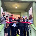 Chaplain Patti Yetneberk and her team prepare to cut the ribbon on the new Snoqualmie Valley Healing Center, Nov. 6, 2025. (Grace Gorenflo/Valley Record)