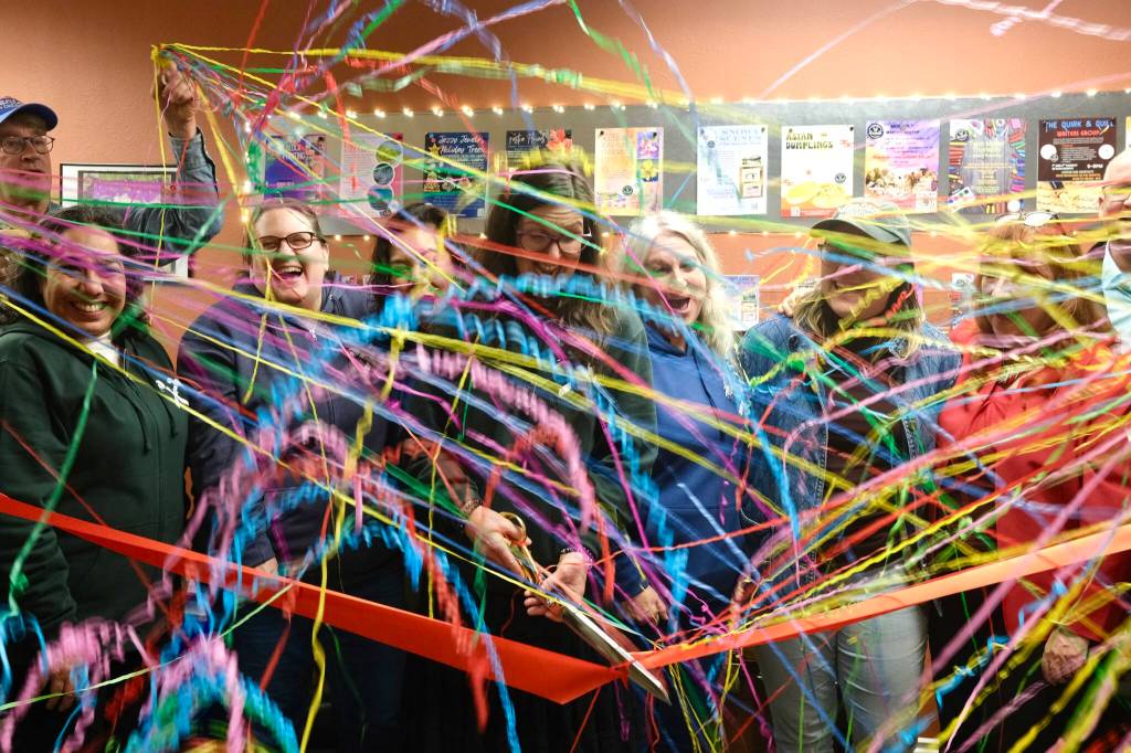 North Bend Art & Industry board members celebrate after the Center for Creativity ribbon is cut, Dec. 8, 2025. (Grace Gorenflo/Valley Record)