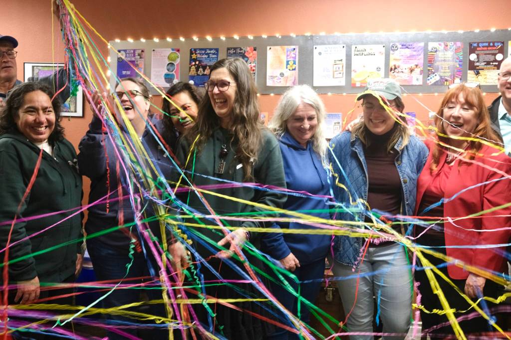North Bend Art & Industry board members celebrate after the Center for Creativity ribbon is cut, Dec. 8, 2025. (Grace Gorenflo/Valley Record)