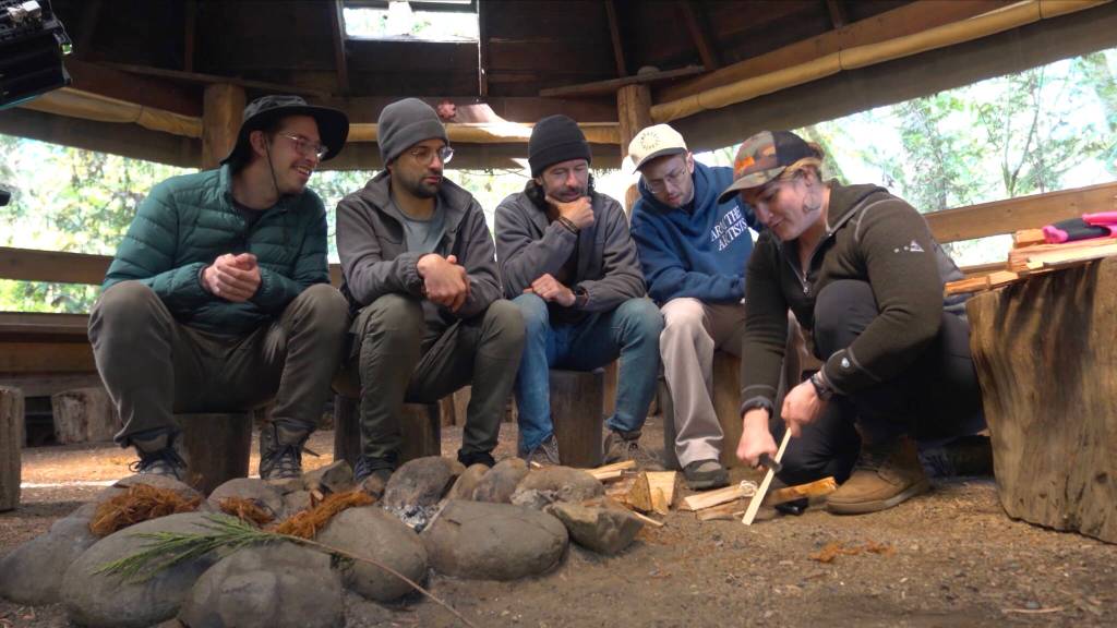 Instructor Phoebe Reid (right) teaches The Try Guys to make fire without a lighter. Images courtesy of The Try Guys via YouTube