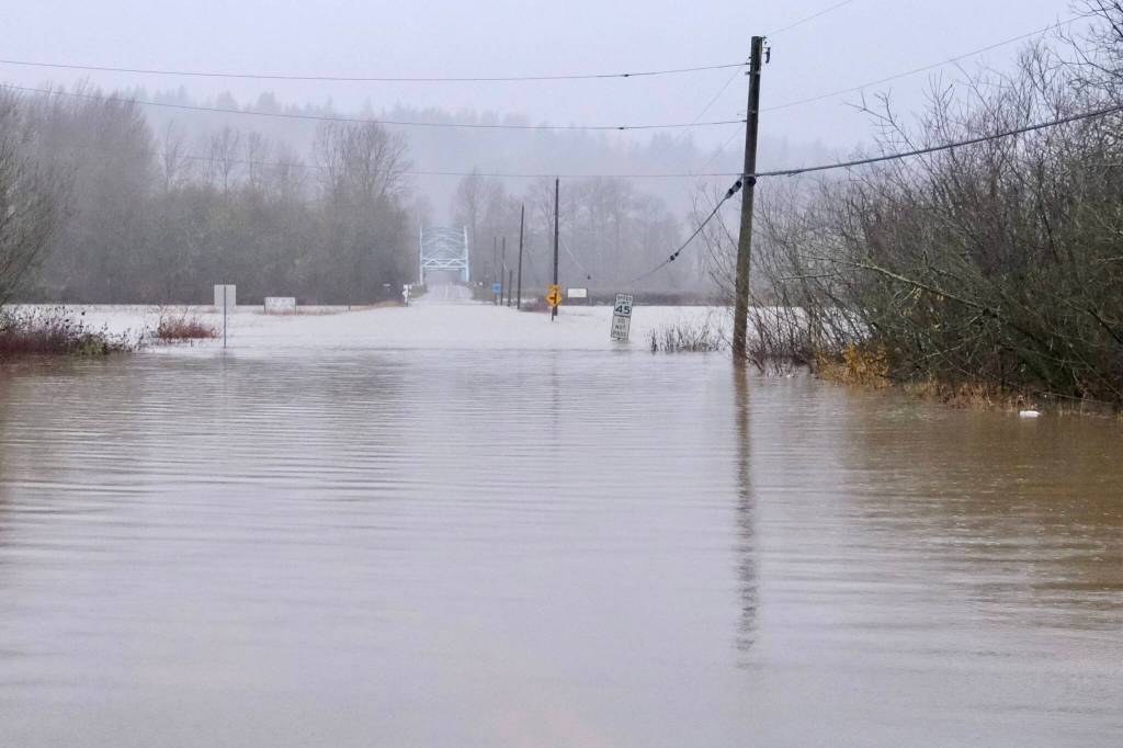 NE 124th Street is closed due to flood water, Dec. 10, 2025. This part of the road is right next to the Local Roots Farm property. (Grace Gorenflo/Valley Record)
