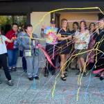 Chickadee Bakeshops owners cut the ribbon on their new bakery, surrounded by community members, Oct. 6, 2025. William Shaw/Valley Record