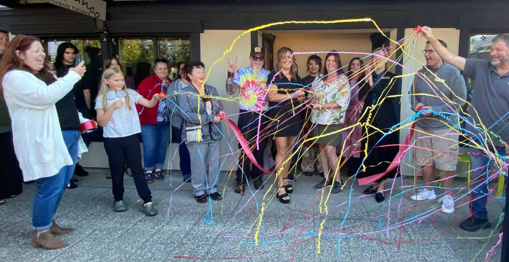 Chickadee Bakeshops owners cut the ribbon on their new bakery, surrounded by community members, Oct. 6, 2025. William Shaw/Valley Record